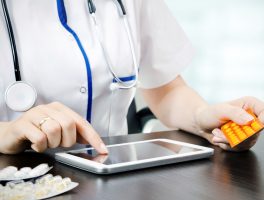 Doctor working on a digital tablet